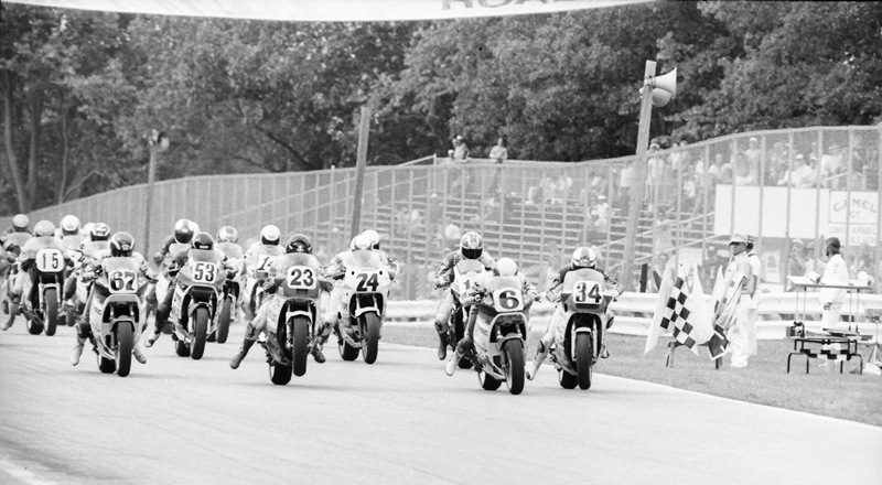 The start of the 1987 AMA Superbike race at Road America. On the front row are Bubba Shobert (No. 67), Doug Polen (No. 23), Wayne Rainey (No. 6) and Kevin Schwantz (No. 34). Schwantz won the race over Rainey and Polen. (Larry Lawrence photo)