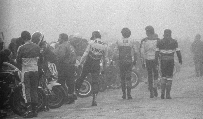 Foggy Elkhart WERA National Endurance teams walk on pit lane waiting for a heavy fog to clear at the WERA National Endurance race at Elkhart Lake’s Road America in October of 1984. (Larry Lawrence photo)