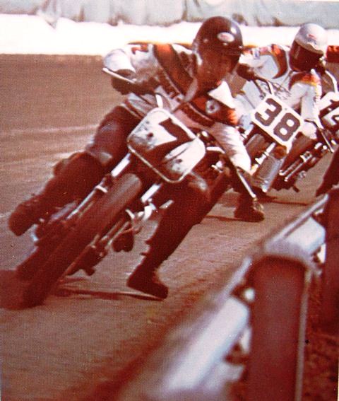 Mert Lawwill hugs the rail at the 1975 Syracuse Mile as he races his factory Harley-Davidson through a turn in front of the Yamaha of Chuck Palmgren (No. 38). You can also just see the front of Hank Scott’s Yamaha behind Palmgren. (AMA press photo)