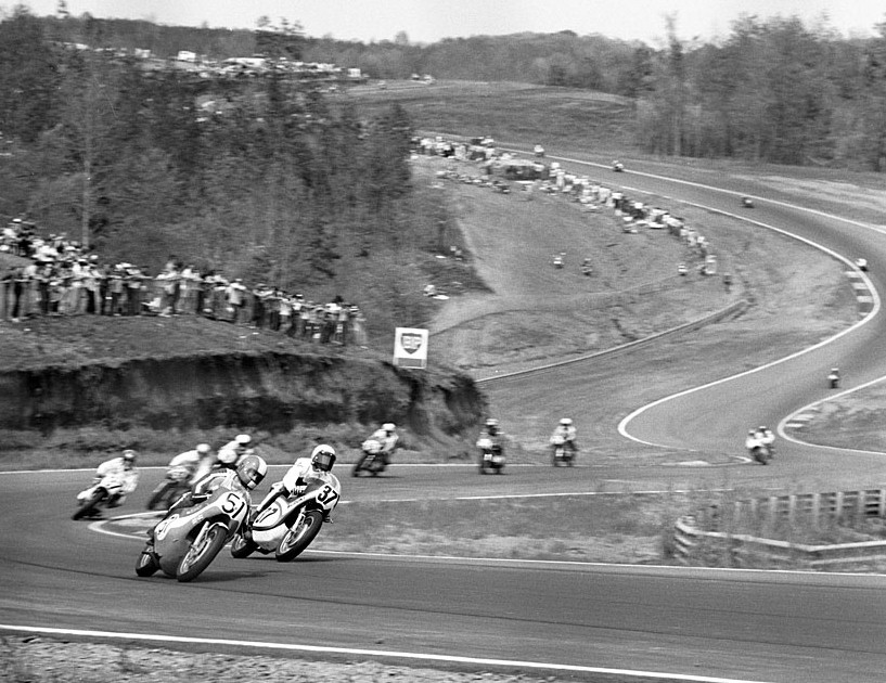 Wilvert - Pierce Two of the classic riders of the 1970s, Hurley Wilvert (No. 51 Kawasaki) leads Ron Pierce (No. 37 Suzuki) and other riders through turn five at Road Atlanta in 1971. (Bud Turner Collection)