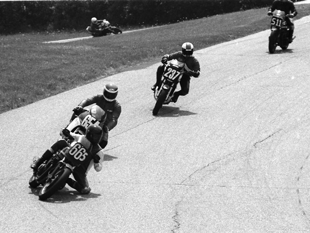 Braunscheidel - Grattan 7-84 Robby Braunscheidel (No. 665) and his Kawasaki GPz550 leads the Yamaha RZ500 of Kenneth Stephens (No. 654), Dan Thomson (No. 237) on his Yamaha RZ350, Dave Barnard (No. 511) on another GPz550 and in the background Neil Tolhurst on his RZ350. This was a WERA C Production Novice race in July of 1984. (Larry Lawrence photo)