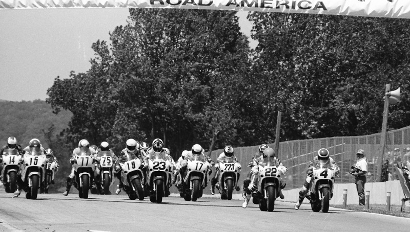 Elkhart 750SS - 1988 The field jumps out of the starting gate at the start of the AMA 750 Supersport final at Road America in Elkhart Lake, Wisconsin in June of 1988. David Sadowski ((No. 4) and Scott Russell (No. 22) both nailed the start perfectly. Surprisingly Doug Polen (No. 23) seems to have gotten a bad launch causing Mike Smith (No. 19) to veer hard to the right. Polen won the race and eventually the championship. (Larry Lawrence photo)
