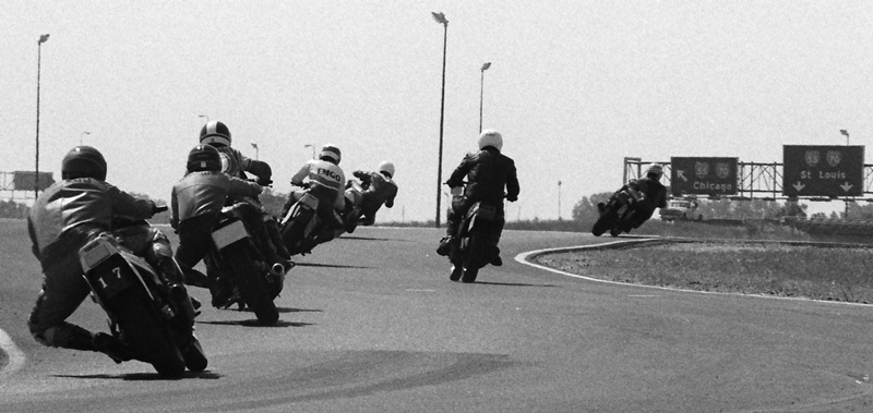 In this photo taken during a WERA National Endurance race at Gateway International in May of 1985, it appears riders have options on where they want to go – Chi-Town or St. Louis. The track was situated near a major Interstate intersection. (Larry Lawrence photo)
