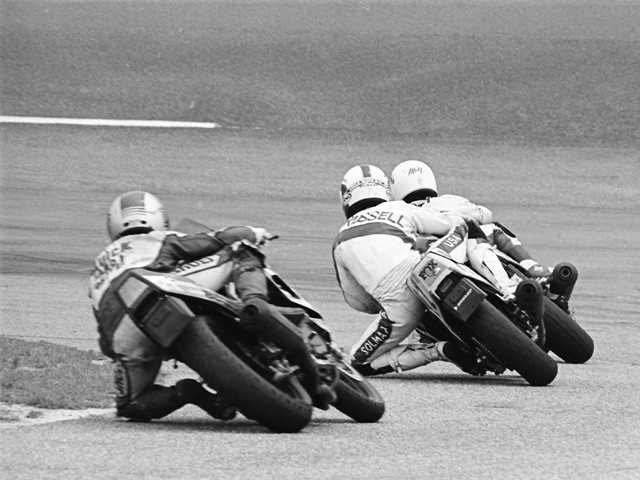 Mike Harth leads Scott Russell and Jamie James out of the infield and onto the banking during a WERA B Production final at Rockingham in July of 1987. (Larry Lawrence photo)