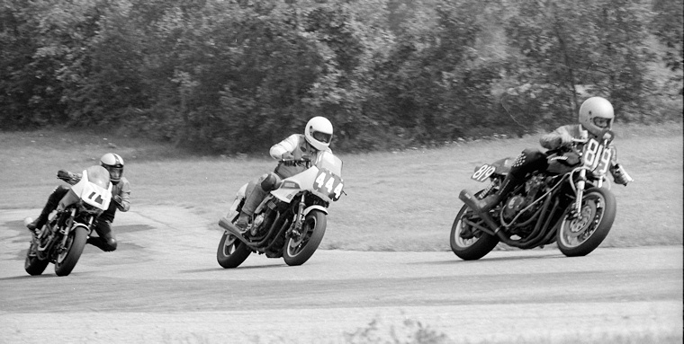 Johnson - Pocisk - Hart Gilbert Johnson, riding a Kawasaki KZ1000, leads Gerald Pocisk on the No. 444 Suzuki GS700E and Ned Hart on his No. 229 Honda VR750 during a WERA A Superbike Novice race in July of 1984. Hart got around the other two to score the podium spot. (Larry Lawrence photo)