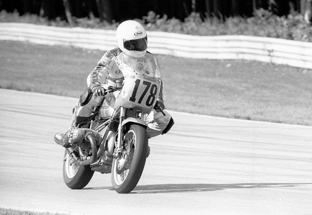 Karten, Dave - Elkhart '87 Dave Karten brakes on his CC Products BMW entering turn five at Road America in Elkhart Lake, Wisconsin, in June of 1987. In ’87 he scored a couple of top 10 finishes in the Pro Twins Modified class, including here at Road America. Just a week earlier he earned a podium finish (second) at Loudon. (Larry Lawrence photo)