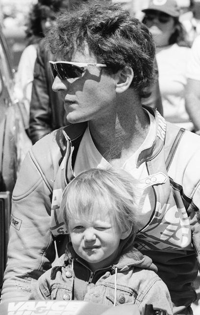 Ski & Jr - Daytona 1990 David Sadowski holds his son David Jr. during a riders’ meeting at Daytona International Speedway in March of 1990. Sadowski the senior won that year’s Daytona 200.(Larry Lawrence photo)