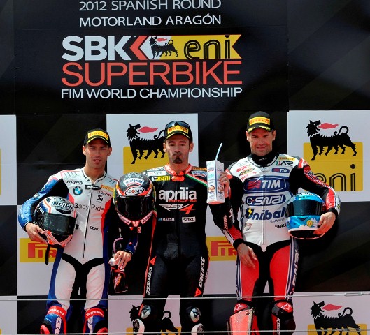 Sunday_Race1_podium-sm Like last year Max Biaggi (Aprilia Racing Team) and Marco Melandri (BMW Motorrad Motorsport) scored a win apiece in the eni FIM Superbike World Championship round today, after two classic races unfolded during each 20-lap contest. Biaggi now has 20 career wins to his credit, Melandri seven.