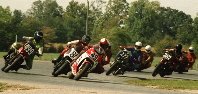 Steve Tayler (No. 49) races his Yamaha RZ500 in front of a pack of riders heading into the hairpin at Indianapolis Raceway Park during a WERA sprint race (probably A Production) in September of 1984. (Larry Lawrence photo)