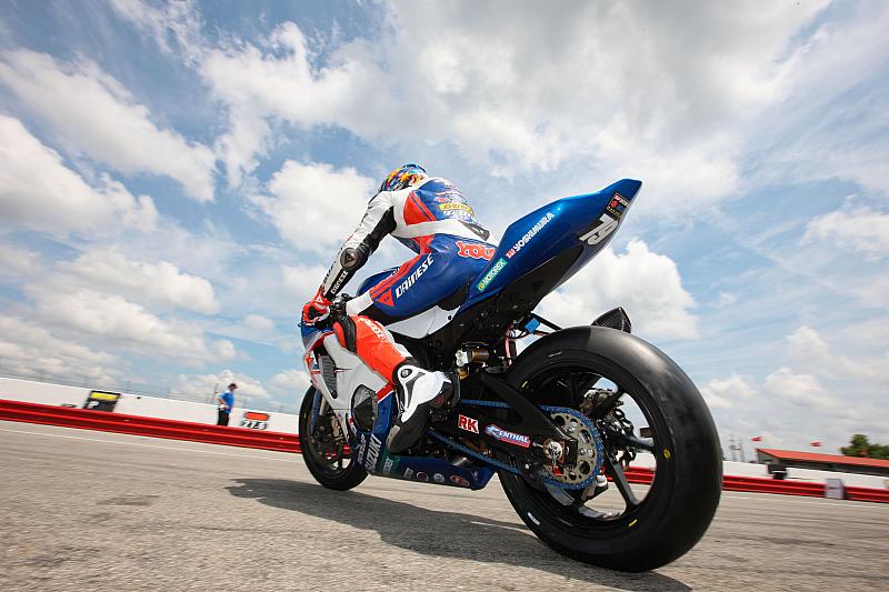 Young Sky - BJN16766 Photographer Brian J. Nelson took this unremarkable moment of Blake Young riding out of the pits at Mid-Ohio and turned it into a stunning photograph by getting low and using the clouds as a dramatic background. (Brian J. Nelson photo)