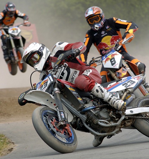 David Baffeleuf is on the gas hard on his Husqvarna Supermoto race bike as he makes the transition from dirt to pavement in the AMA Supermoto Championship race at Shawano, Wisconsin in July of 2006. Baffeleuf was a master of running hard on the pavement even with tires still dirty from the MX or flat track section of the circuit. (Larry Lawrence photo)