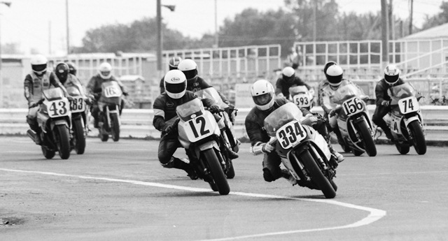 Landrey, Steve - Gateway 6-96 Steve Landrey, on his Suzuki GSXR750, leading the pack into the first turn in a WERA B Production final at Gateway International Raceway in June of 1986. Ralph Johnston (No. 12) won the Suzuki and Yamaha paying race over runner up Terry Hampton (No. 43). (Larry Lawrence photo)
