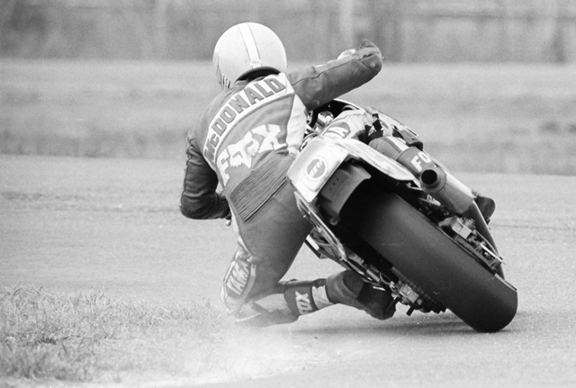 McDonald, Sam - Talladega 3-87 Sam McDonald leans his Yamaha FZ750 Superbike into a turn and kicks up some dust with his knee during a WERA sprint race at Talladega Gran Prix Raceway in March of 1987. (Larry Lawrence photo)