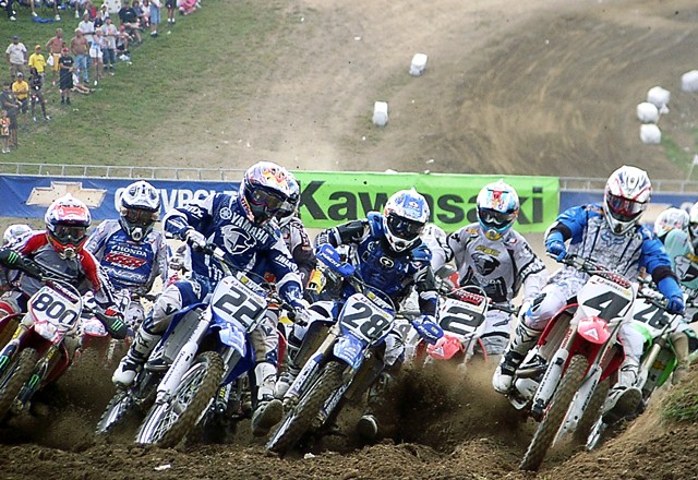 Ricky Carmichael (No. 4) has the inside line at the Steel City National in 2004. Carmichael went on to win the event, wrapping up the 2004 AMA Chevrolet 250cc Motocross Championship. Also visible in the shot are Heath Voss (No. 28), Chad Reed (No. 22), Mike Alessi (No. 800) and Jeremy McGrath (No. 2). (Larry Lawrence photo)