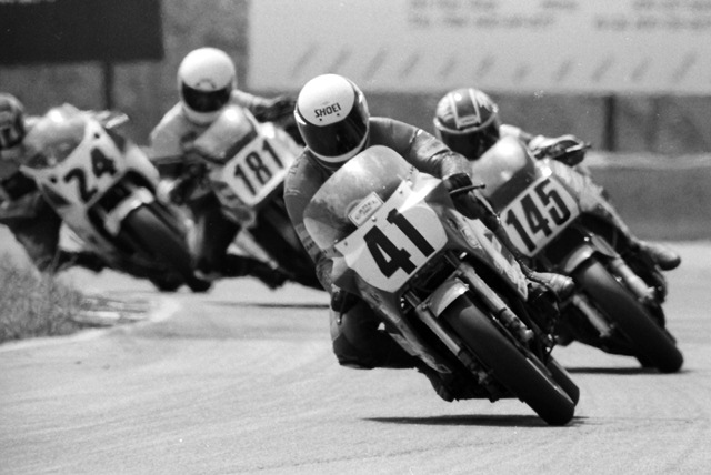Andrew, Carry - Rd. Atl. 1987 Carry Andrew leads a group of riders that includes Philip Berke (No. 145), Rick Shaw (No. 181) and Rueben McMurter (No. 24) out of the final turn at Road Atlanta during the AMA Superbike race there in May of 1987. (Larry Lawrence photo)