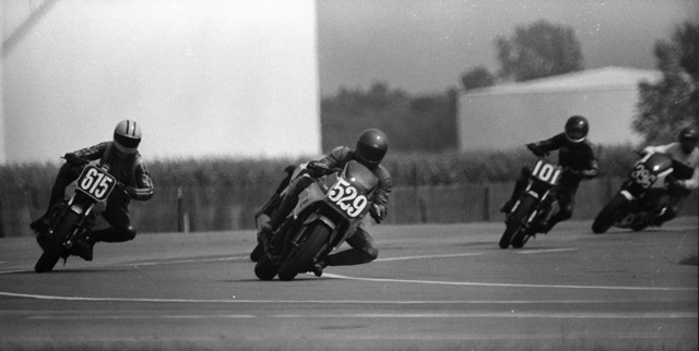 Atkinson, Jay - IRP 9-85 Jay Atkinson (No. 529) leads a group in what is likely a WERA B Superbike race at Indianapolis Raceway Park in September of 1985. Atkinson is racing a Yamaha FZ750 and is leading David Probst (No. 615) riding a fairly rare Suzuki Katana 550, Mac Tillman (No. 101) on a Kawasaki KZ550 and an unidentified rider on No. 396 on what looks like a Honda Interceptor. (Larry Lawrence photo)