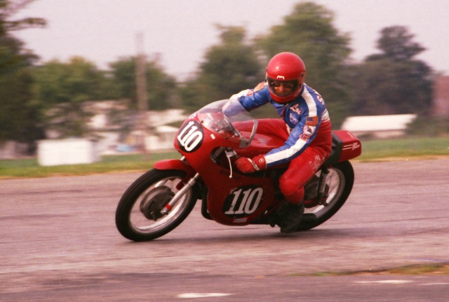 Snedden, Lou - IRP 9-85 Lou Snedden races what I think is a Ducati 250 in a Vintage class during a WERA sprint weekend at Indianapolis Raceway Park in September of 1985. Lou owned Lou’s Leathers. (Larry Lawrence photo)