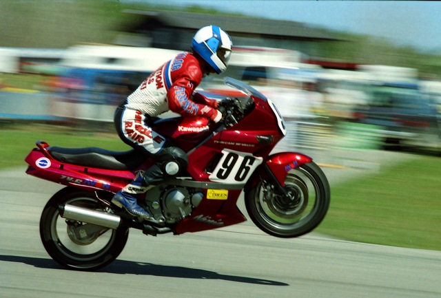 Taylor, Michael - Grattan - 4-90 Canadian Michael Taylor uses more than a little body English to keep the front wheel down on his incredibly stock looking Kawasaki ZX-6 going over the jump at Grattan, during a WERA sprint race in April of 1990. (Larry Lawrence photo)