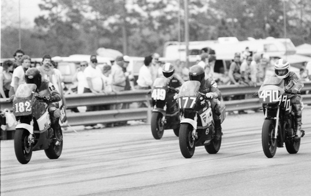 On the white flag lap Omar El-Khalidi (No. 182) battles side by side with Alan Jacobs (No. 177), Patrick Harris (No. 490) and David Dearing (No. 419). Jacobs came out on top taking the victory in the WERA C Superbike race at Roebling Road in March of 1986 over El- Khalidi, Harris and Dearing. (Larry Lawrence photo)