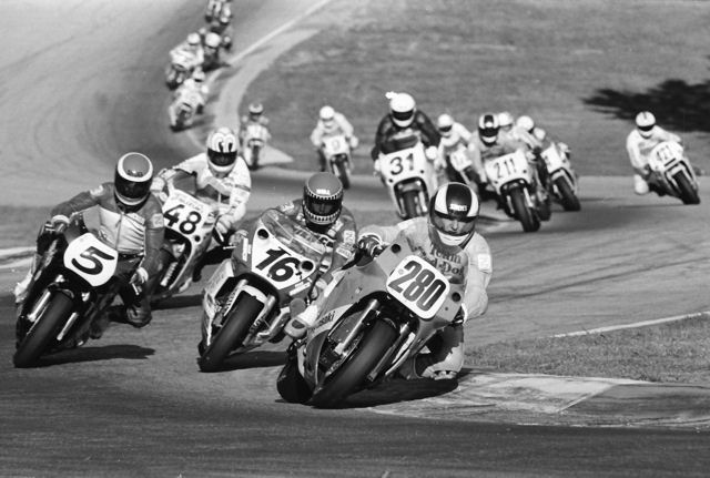 Locklear, Larry - GNF 1990 Texan Larry Locklear heads a pack of riders that includes Tom Kipp (No. 16), Michael Martin (No. 5) and Kevin Rentzell (No. 48) in a WERA Pro Formula USA race during the GNF at Road Atlanta in November of 1990. (Larry Lawrence photo)