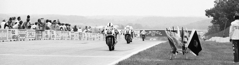Russell, Scott - Elkhart 1989 In this wide panoramic shot Scott Russell leads Yoshimura Suzuki teammate Jamie James in the 1989 AMA Superbike race at Road America in Elkhart Lake, Wisconsin. (Larry Lawrence photo)