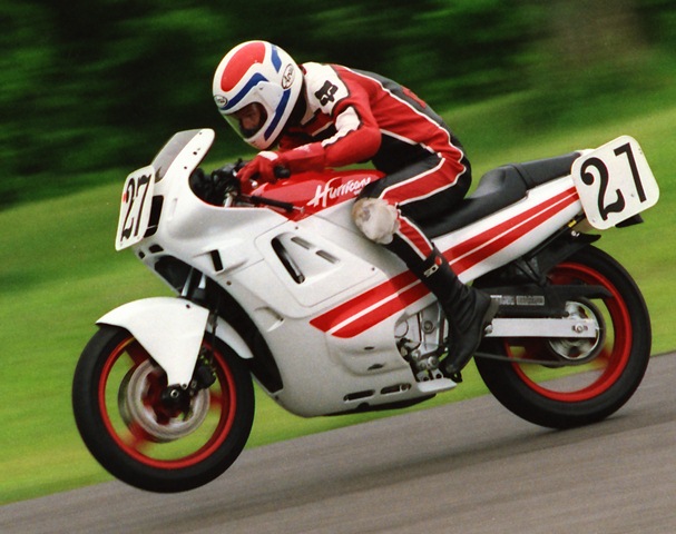Oldham, Mark - Grattan 5-87 Mark Oldham shows picture-perfect form as he tucks in and wheelies his Honda Hurricane during a WERA sprint race at Grattan Raceway in May of 1987. (Larry Lawrence photo)