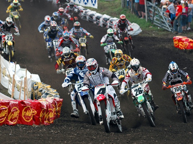 Unadilla 2004 250m1start Ricky Carmichael leads Aussies Chad Reed (No. 22) and Michael Byrne (No. 26) at the start of the 2004 AMA Chevrolet 250cc Motocross Championship race in New Berlin, N.Y. Carmichael, riding a Honda, won his sixth-straight race at Unadilla that day making him undefeated at the halfway mark season. (Larry Lawrence photo)
