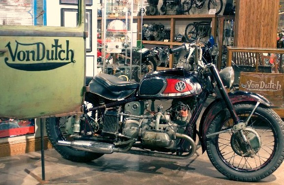 Von Dutch The XAVW is surrounded by Von Dutch sculptures, personal pin-striping brushes, graphic works, autographed tools, and an amazing engraved aluminum motorcycle helmet.