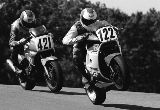 Phil Pummell and Fritz Kling battle over the Grattan jump in the season finale of the Michigan Gran Prix in September of 1988. Pummell won the race and the championship. Kling’s Yamaha threw a chain late in the race costing him the title. (Larry Lawrence photo)