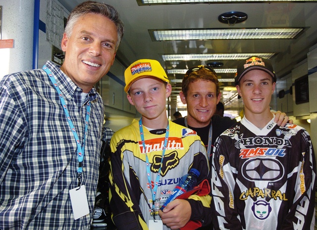 Huntsman and RC-sm Then Utah Governor Jon Huntsman, Jr. and his sons pose for a photo with Ricky Carmichael during the AMA Motocross National at Lakewood, Colorado in July of 2005. (Larry Lawrence photo)