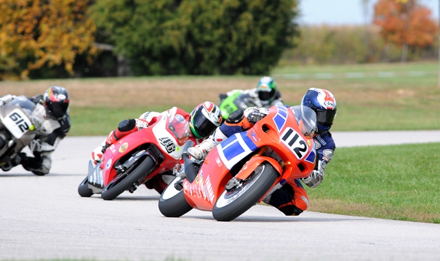 Jasso, Adrian - AMAGC - Putnam 10-9-11 Adrian Jasso leads the USGPRU 250GP race during the AMA Road Race Grand Championships at Putnam Park road Course in October of 2011. Jasso rides ahead of Andre Ochs (No. 46), eventual winner Robert Hancock (No. 612) and Max Flinders (on the green bike in the background). (Larry Lawrence photo)