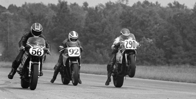 Swims, Deano - Roebling 7-86 Deano Swims (No. 56) nails the holeshot as Steve Nardiello (No. 92) gets caught napping and Mark Schledorn (No. 290) gets a nice power wheelie off the line. This was the front row of a WERA Formula 1 race at Roebling Road Raceway in July of 1986. (Larry Lawrence photo)