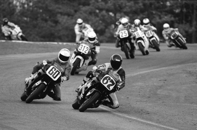 Tysor, Greg - 1987 GNF - CSB Greg Tysor (No. 67) leads Kurt Hall (No. 60), Cam Roos (No. 312), Jim Still (No. 25), Kevin Rentzell (No. 48) and the rest of the field in the C Superbike final at the WERA Grand National Final in November of 1987. Tysor won the race and the championship. (Larry Lawrence photo)