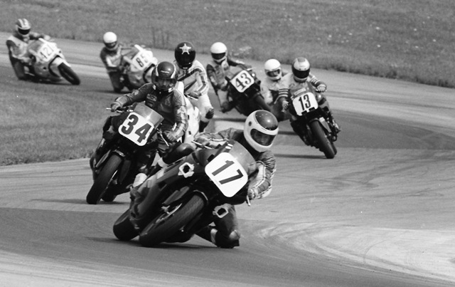 Eidenberger, John - Grattan CCS July '87 John Eidenberger leads a talented group of riders in an AMA/CCS Middleweight Supersport race at Grattan Raceway in July of 1987. Eidenberger got the jump on the field and pulled away to a convincing victory. (Larry Lawrence photo)