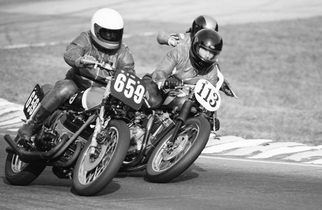 Greenway, Richard - GNF 1986 Richard Greenway dives his (No. 113) Triumph underneath the Kawasaki triple of Mark Williams (No. 659) during the WERA Vintage 4 race at the1986 Grand National Final at Road Atlanta. (Larry Lawrence photo)