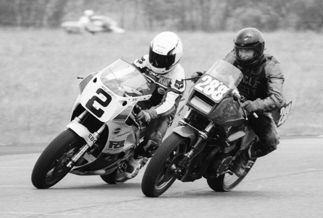 Hall and Smiling rider In spite of being passed by Kurt Hall this anonymous rider looks like he’s having a blast trying to match the HRT Yamaha in acceleration out of a turn at Little Talladega during an endurance race in June of 1987. (Larry Lawrence photo)