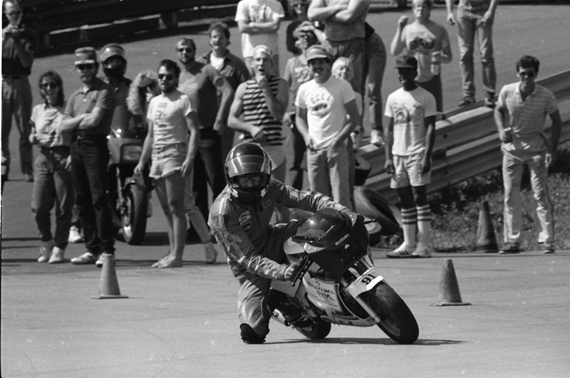 Key on minibike I don’t know what Ed Key is doing here (possibly catching one of the other mini-bike riders), but he must be doing something pretty special - check out the reaction of the crowd! (Larry Lawrence photo)
