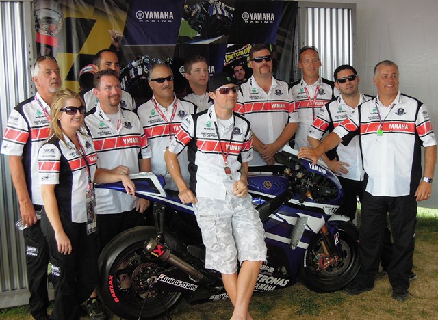 Spies and Yamaha crew - IMS 2011 Ben Spies poses with the crew that worked Yamaha's display tent during the 2011 Red Bull Indianapolis GP. It was a big weekend for Spies. He qualified on the front row (second to Casey Stoner) and scored a podium finish (third). (Larry Lawrence photo)