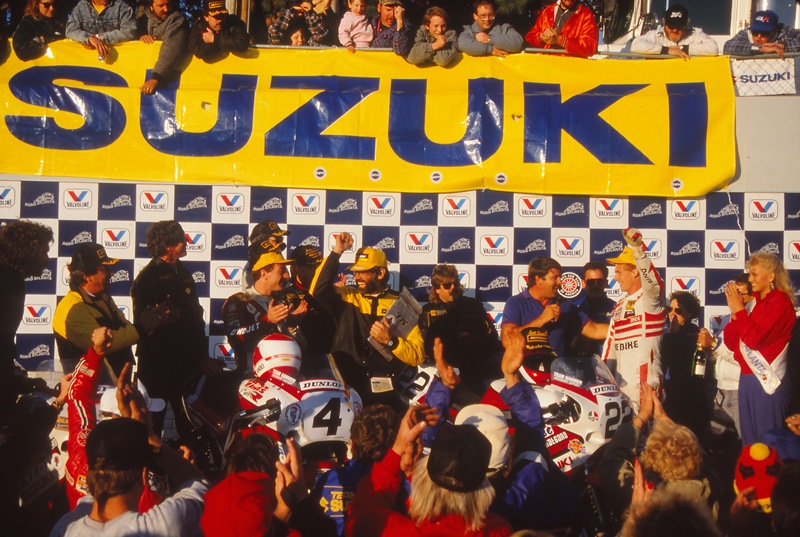 Georgia fans are ecstatic that home state hero Scott Russell (to the right with fist in the air) has just won a thrilling Suzuki GSXR750 Cup Final at road Atlanta over David Sadowksi. Russell is about to be intervied by former racer Richard Chambers. Dunlop’s Jim Allen (center) looks to be nearly as happy as Russell. Sadowski looks on and sportingly applauds Russell. (Larry Lawrence photo)
