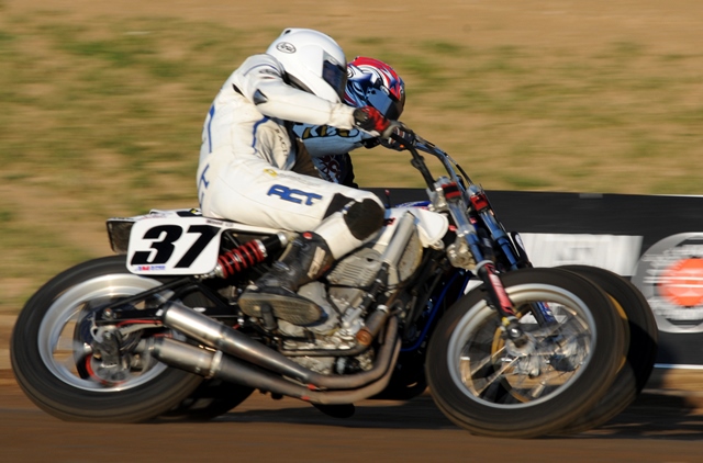 Jimmy Wood on his No. 37 Kawasaki and Raun Wood on the No. 88 Baer Racing/Scott Powersports Kawasaki race bar to bar (literally) around turn one at I-96 Speedway during qualifying for the AMA Grand National in July of 2011. (Larry Lawrence photo)