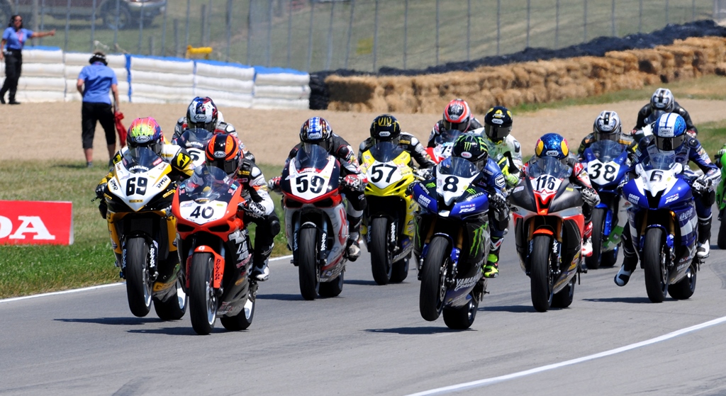 This shot is the start of the Sunday Daytona SportBike race in 2011. It shows Jason DiSalvo (No. 40, on the Team Latus Motors Racing Ducati 848, getting the jump on the rest of the field which included Danny Eslick (No. 69), Jake Holden (No. 59), Cory West (No. 57), Josh Herrin (No. 8), Cameron Beaubier (No. 116), Kris Turner (No. 38) and Tommy Aquino (No. 6). Eslick went on to edge Aquino and Beaubier to take the win. The Mid-Ohio round runs this weekend. (Larry Lawrence photo)