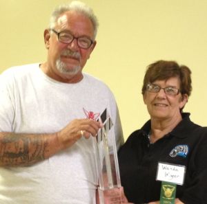 AMF’s Wanda Winger presents the Antique Motorcycle Foundation Award of Excellence to Fred Davis, President of the Lake Erie Chapter of the Antique Motorcycle Club of America.