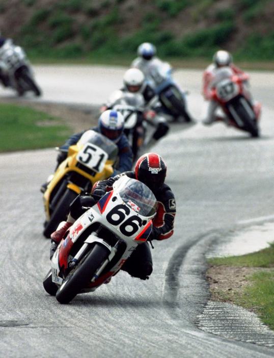 Doug Gere leads a pack of riders out of the chicane onto the east banking at Daytona International Speedway during one of the 1989 Daytona Twin 50s. The Twin 50s were qualifying races that set the grid for the Daytona 200 (except for the front row). The qualifying Heats were later replaced by timed qualifying. (Larry Lawrence photo)