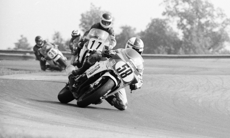 Jamie James (No. 58) leads John Eidenberger (No. 17), Scott Zampach (with the letter Z on his helmet) and Dave Barnard (No. 38) during a WERA B Production race at Grattan Raceway in August of 1986. James won the race, which was Suzuki money race. (Larry Lawrence photo)