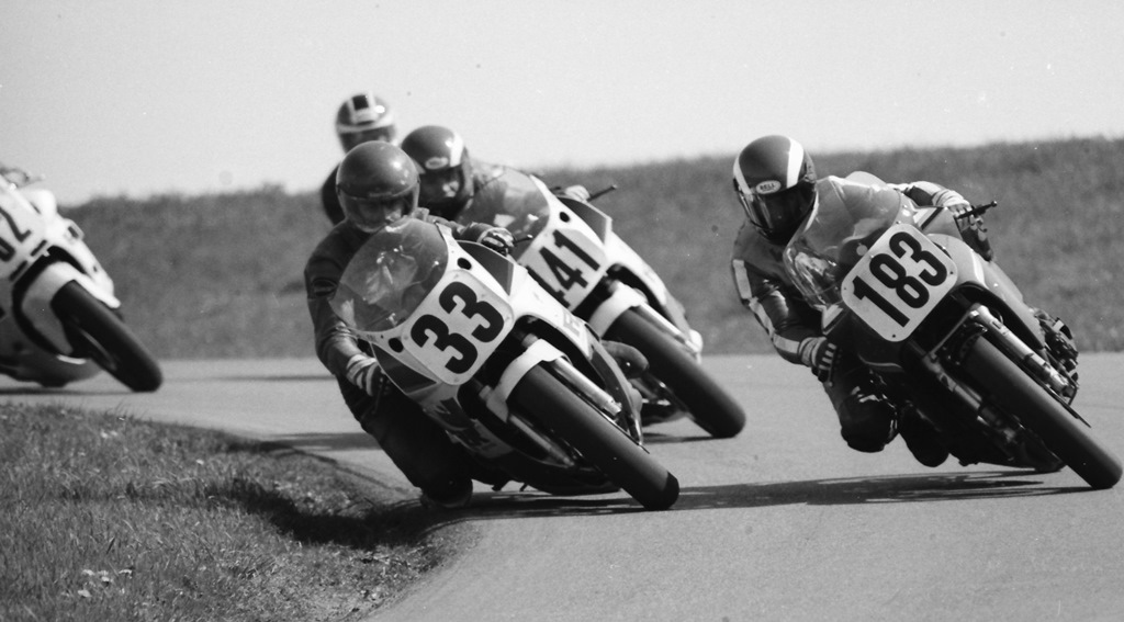 Tom Kipp (No. 33) and Dave Schmidt (No. 183) race side by side through a turn at Grattan during a WERA Spring race in April of 1987. Kipp won two races on the chilly weekend. (Larry Lawrence photo)