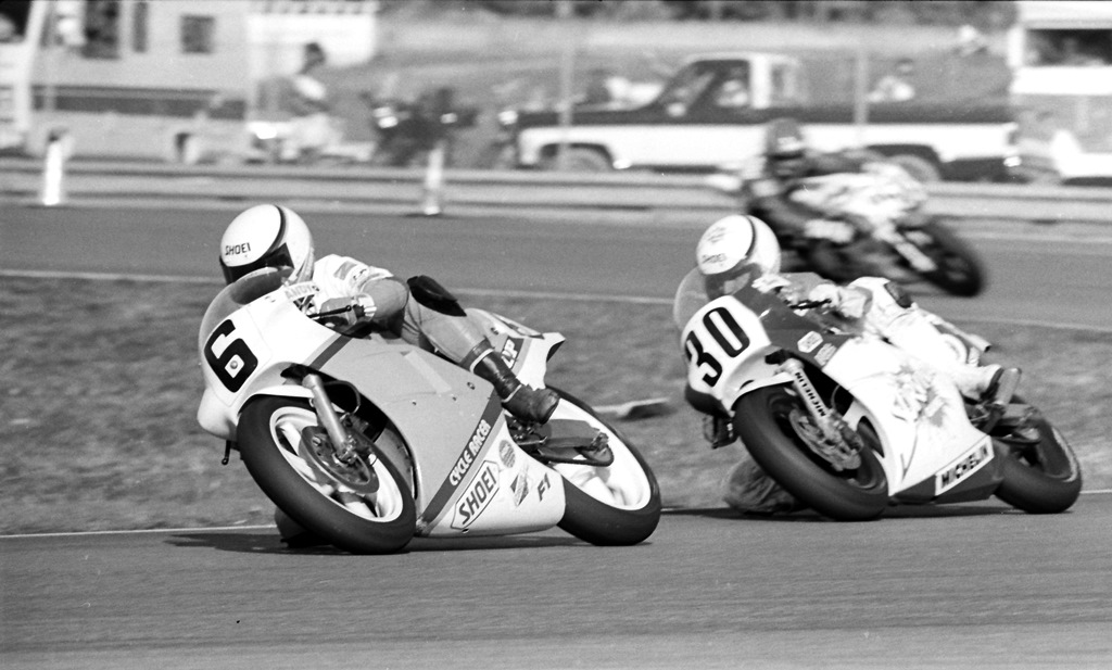 Andy Leisner (No. 6) speeds his AJ Racing Honda through Daytona International Speedway’s West Horseshoe ahead of Lance Jones (No. 30) on his McIver Racer/Survival Games Honda during the 1987 AMA 250 Grand Prix race at Daytona. (Larry Lawrence photo)