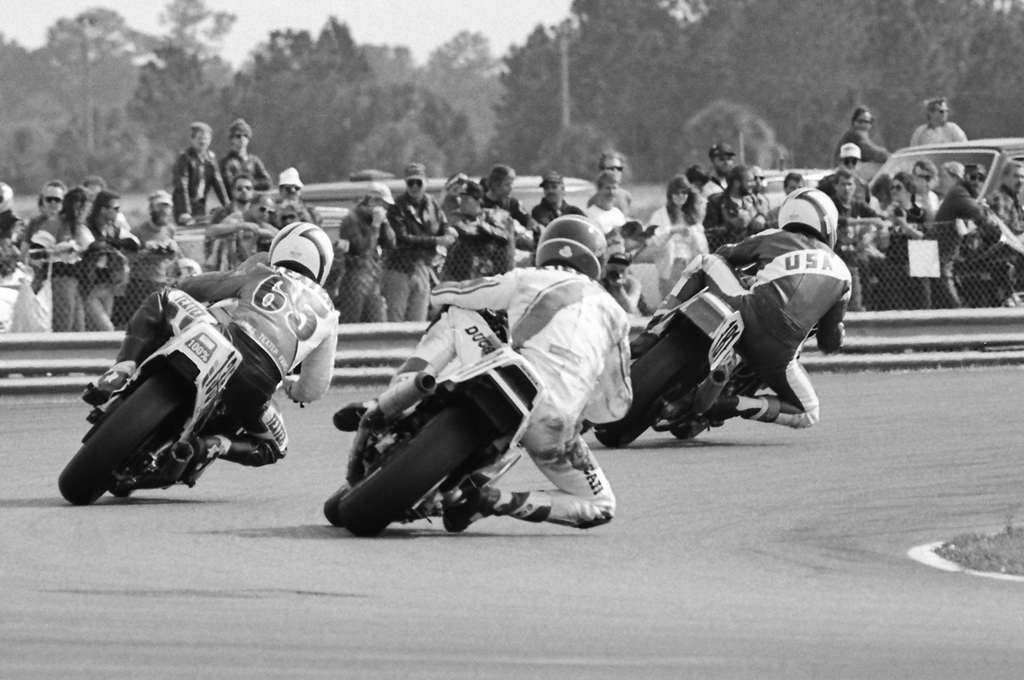 Rick Shaw leads a three-way battle joined by Randy Texter and Dr. Dave Kieffer out of Daytona International Speedway’s International Horseshoe during the 1987 Daytona 200.  Shaw was racing a South Dade Yamaha sponsored Yamaha FZ750, Texter on a Penn State Cycles Suzuki GSXR750 and Kieffer on the Rough Stock Racing Honda VFR750. (Larry Lawrence photo)