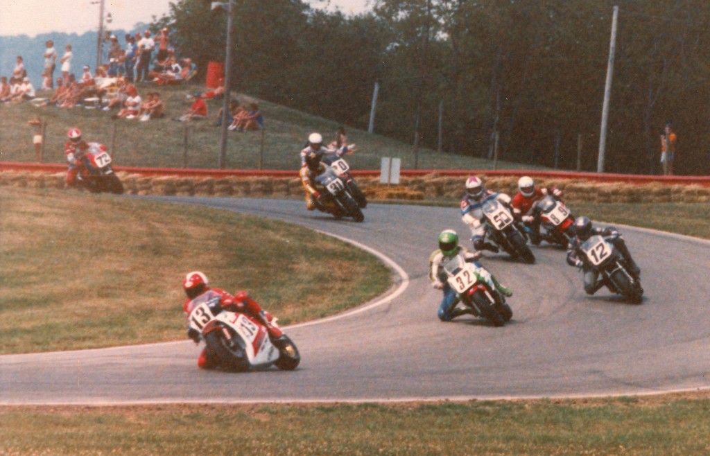 A photo from the collection of former racer Rick Leventhal. When he wasn’t racing Rick was taking photos and we’re fortunate he kept them all these years and is now sharing them with us. I’m not 100 percent sure on these, but I believe this photo from Mid-Ohio shows Ted Boody, Jr. (No. 13) on a Honda RS500 leading Dale Quarterley (No. 32 Yamaha FZ750), Ricky Orlando (No. 12 Honda VFR750), John Bettencourt (No. 50 Honda VFR750), Kevin Monahan (No. 89 Yamaha FZ750), Boonie Knott (No. 31 Suzuki RG500) and Dave Busby (No. 72 Honda VFR750. I can’t make out the rider behind Knott. It sort of looks like John Kocinski or possibly Pat Hernon. Maybe someone will be able to make a positive ID. (Rick Leventhal Collection)