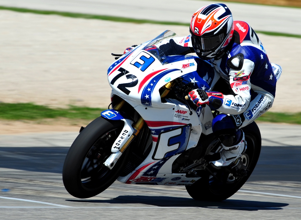 Larry Pegram is so old he’s getting sponsored by AARP! Check out the sticker just below his hand that adorns his beautiful Foremost Insurance EBR Superbike. (Larry Lawrence photo)