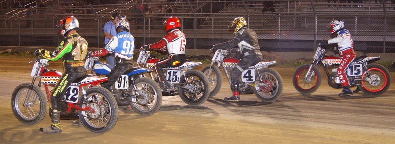 Eventual winner and former AMA Grand National rider Steve Morehead #42, Tom Morgan #91F, 2013 AMA Grand National Championship-winning tuner Dave Atherton #15X, Bill Snyder #4 and former AMA Grand National rider Garth Brow #15 line up on the front row for the Bultaco Astro Race in August 2013 at Mid-America Speedway. All are expected to do battle again in round 10 of the 2014 AMA Vintage Dirt Track National Championship event at the Marion County Fairgrounds-hosted track. Photo by Mike 'Stu' Stuhler/Stu's Shots.
